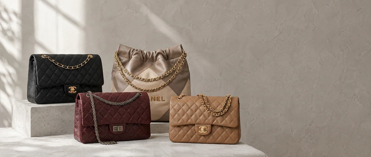 Three leather handbags on a light grey concrete plinth